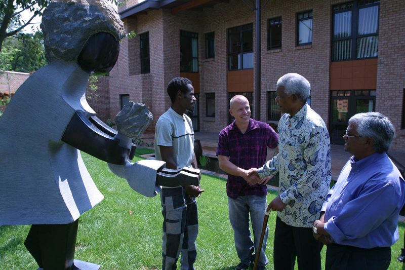 Mandela presenting sculpture Mandela presenting his sculpture to a group
